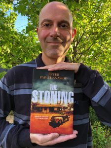 Photo of Peter holding his book.
