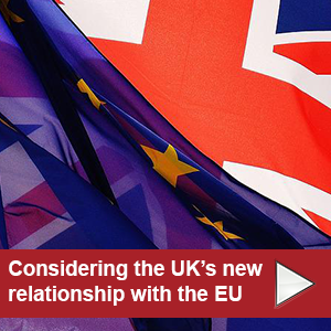 Considering the UK's new relationship with the EU written in front of the EU and British flags on a red box