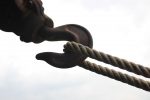 Image of an industrial hook pulling on a rope
