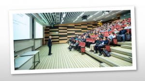 Academic, giving a lecture in a full lecture theatre