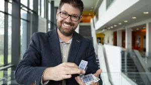 A photo of Dr Gustav Kuhn doing a card trick