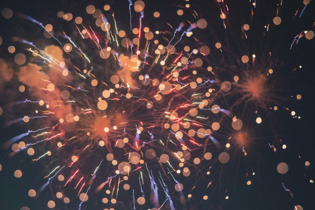 abstract of fireworks setting off against dark background