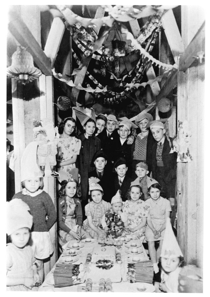 Photo of children at a Christmas party during an air raid
